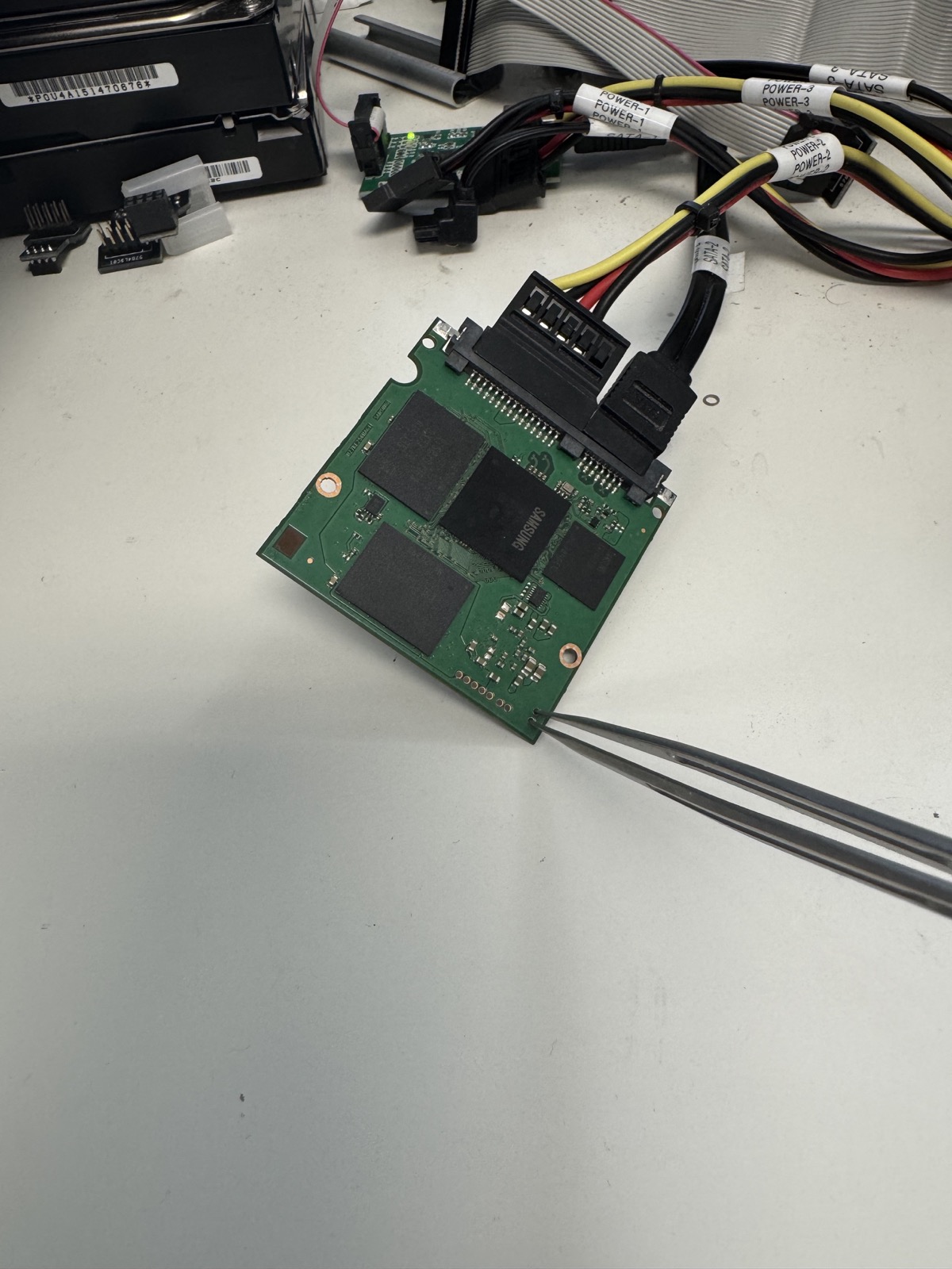 Samsung SSD circuit board connected for controlled recovery access