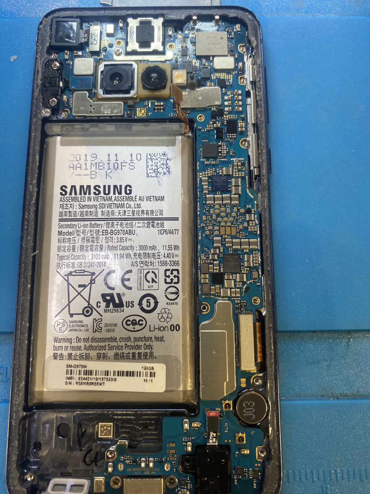 Opened Samsung phone prepared for liquid damage data recovery